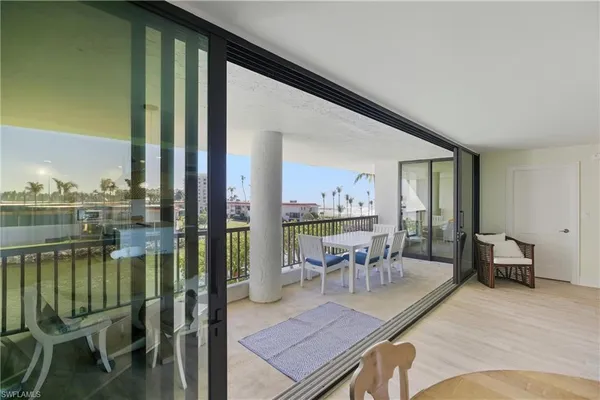 a view of a balcony with chairs