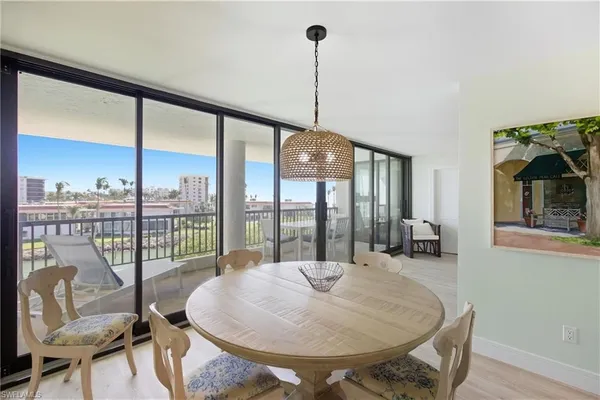 a view of a dining room with furniture window and outside view