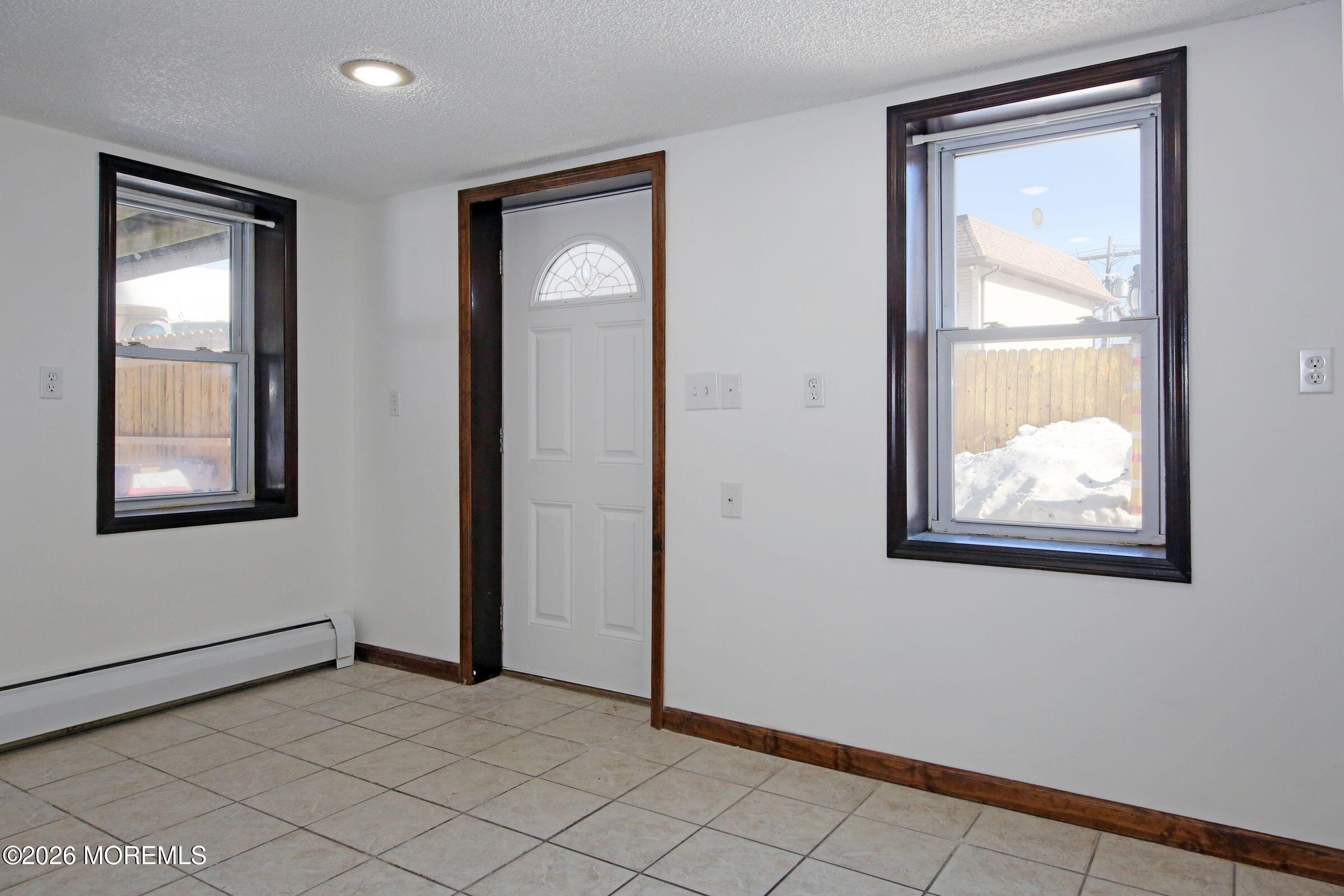 60 Matthew Street, Unit 1 Highlands, NJ 07732 - Photo 3 of 33 an empty room that has a window and closet