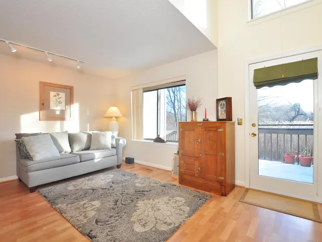 a living room with furniture and a rug