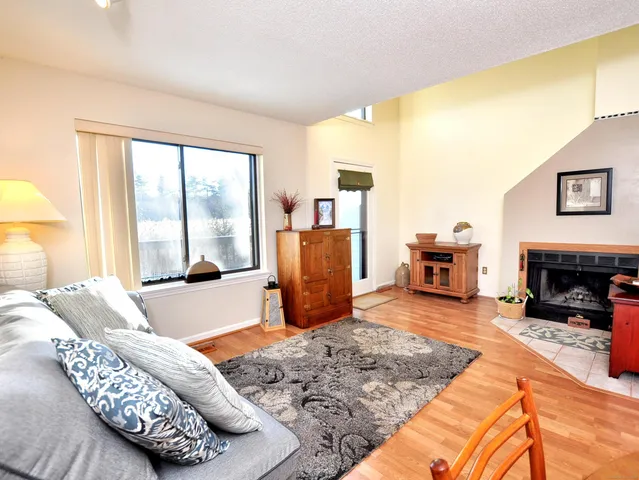 a bedroom with furniture and a fireplace