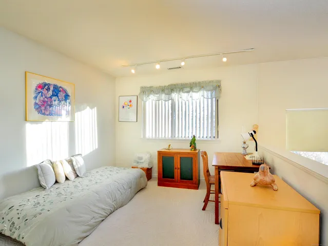 a very nice looking bedroom with a large window