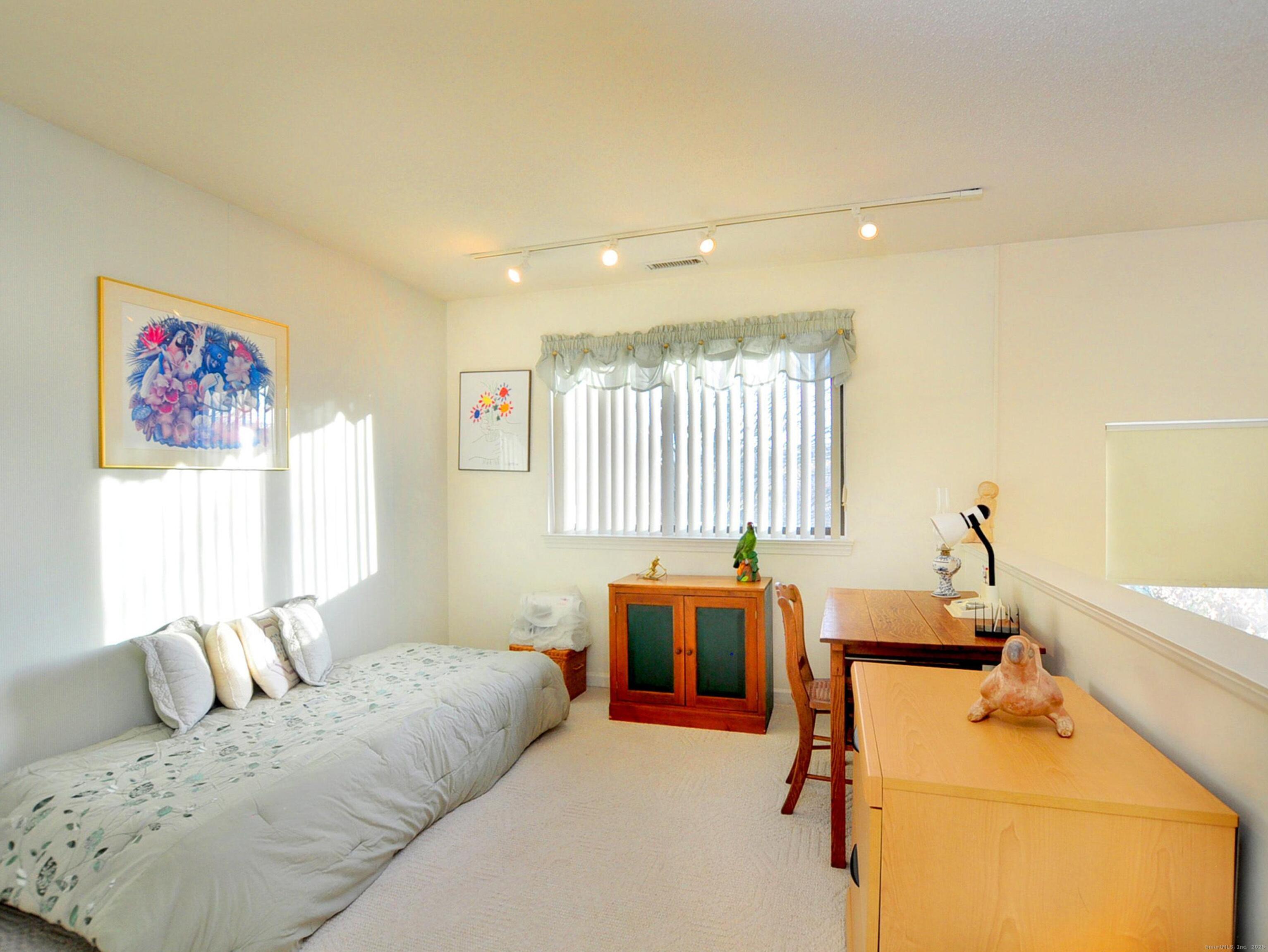 81 Silo Way, Unit 81 Bloomfield, CT 06002 - Photo 21 of 37 a bed room with a bed furniture and a window