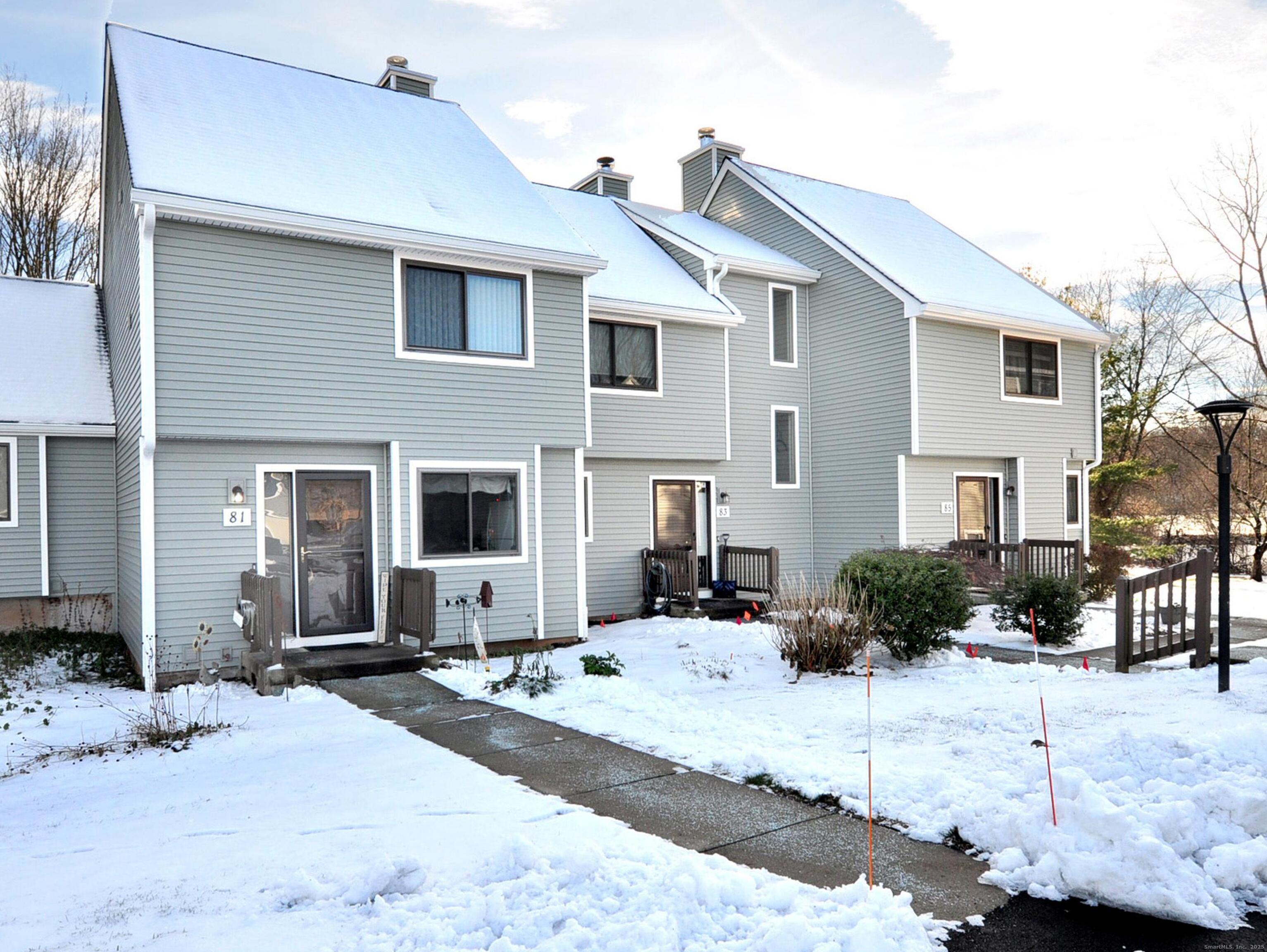 81 Silo Way, Unit 81 Bloomfield, CT 06002 - Photo 3 of 37 a front view of a house with a yard