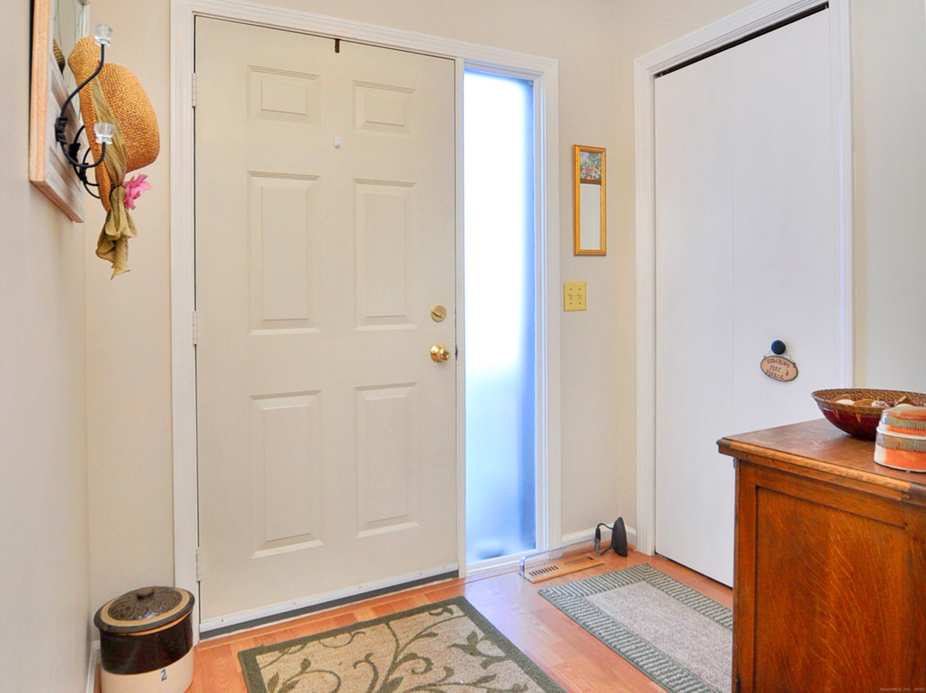 81 Silo Way, Unit 81 Bloomfield, CT 06002 - Photo 5 of 37 a view of a hallway with front door windows and glass door