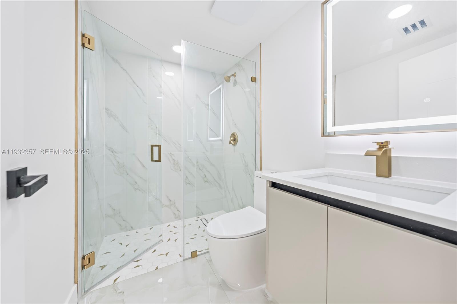 4140 Southwest 108th Avenue Miami, FL 33165 - Photo 18 of 51 a bathroom with a sink a toilet and shower