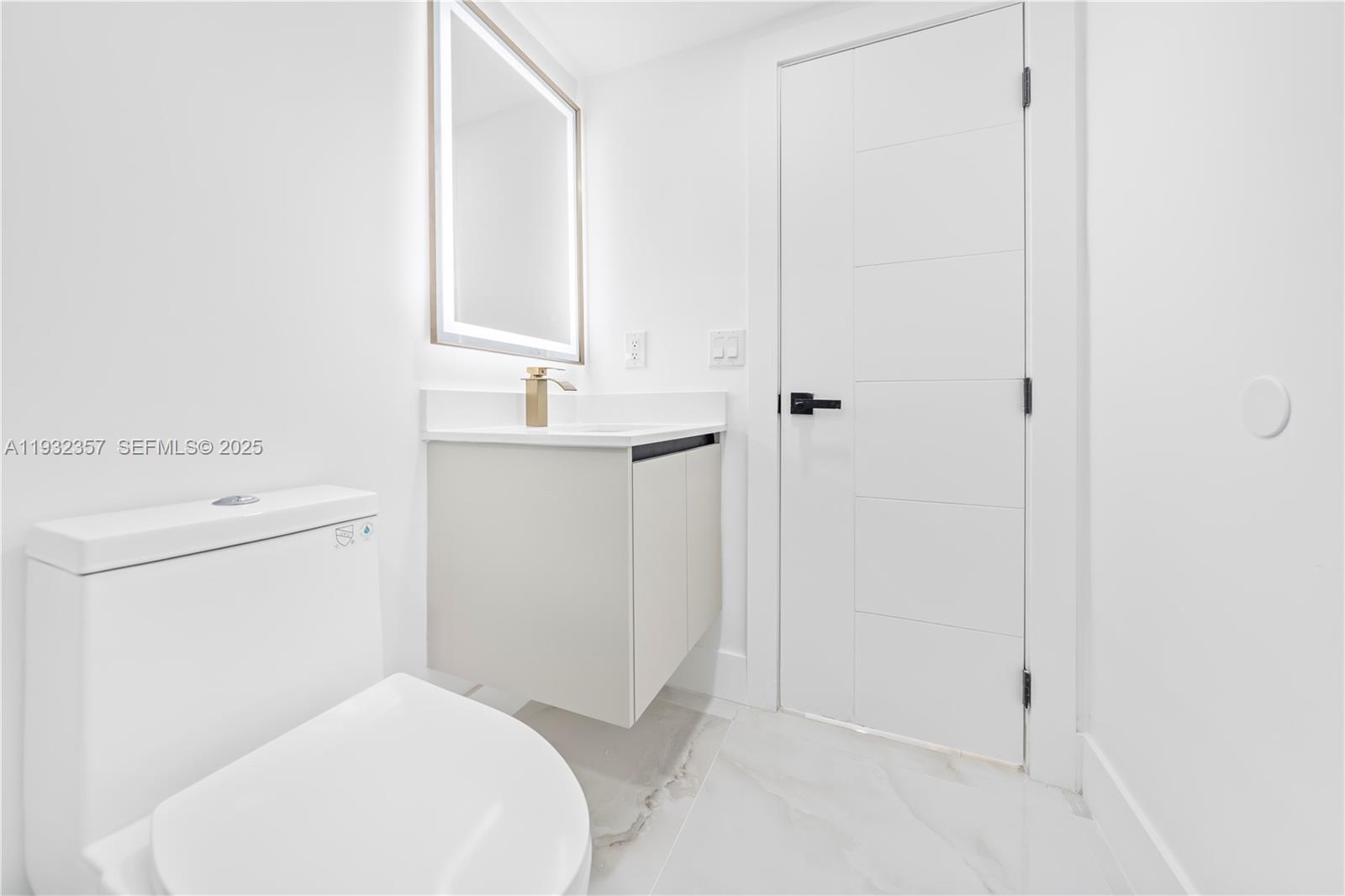 4140 Southwest 108th Avenue Miami, FL 33165 - Photo 21 of 51 a bathroom with a sink a toilet and vanity