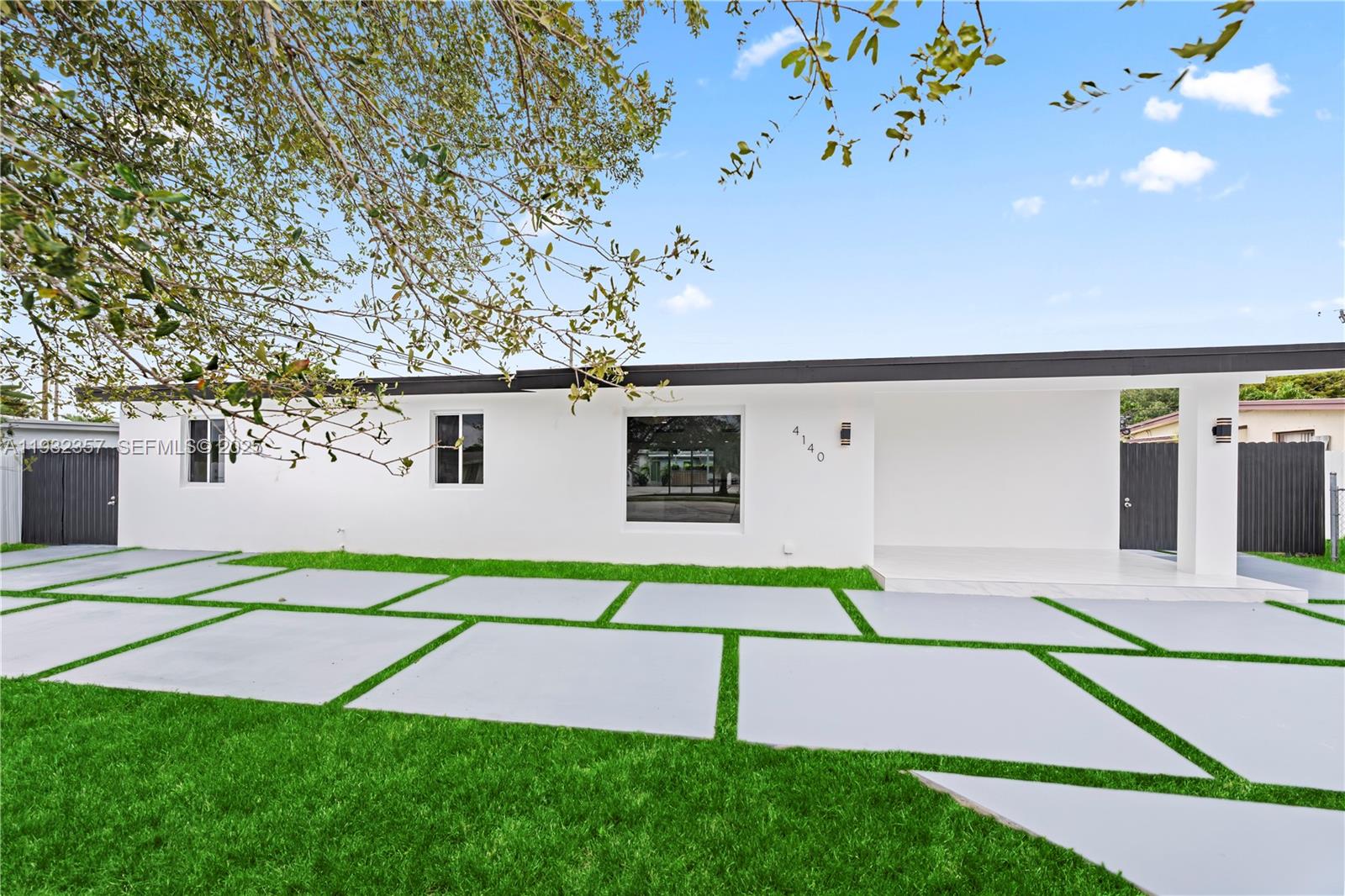 4140 Southwest 108th Avenue Miami, FL 33165 - Photo 3 of 51 a white bench sitting in front of a building