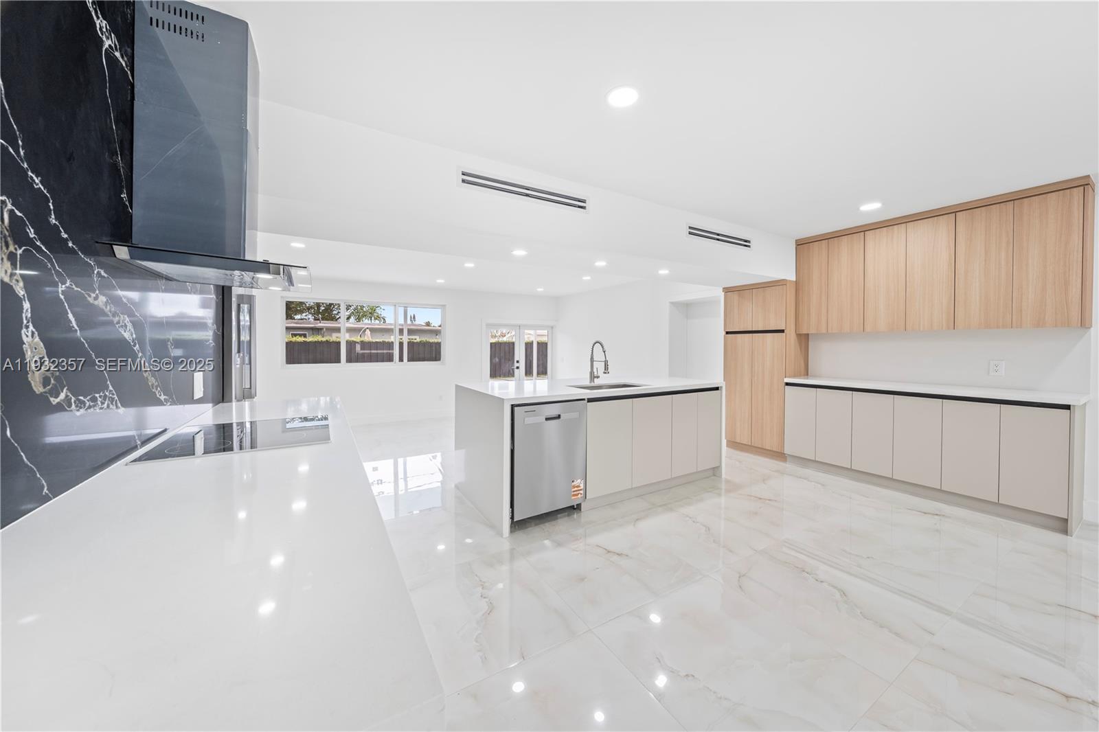 4140 Southwest 108th Avenue Miami, FL 33165 - Photo 35 of 51 a view of a kitchen with a sink and a refrigerator
