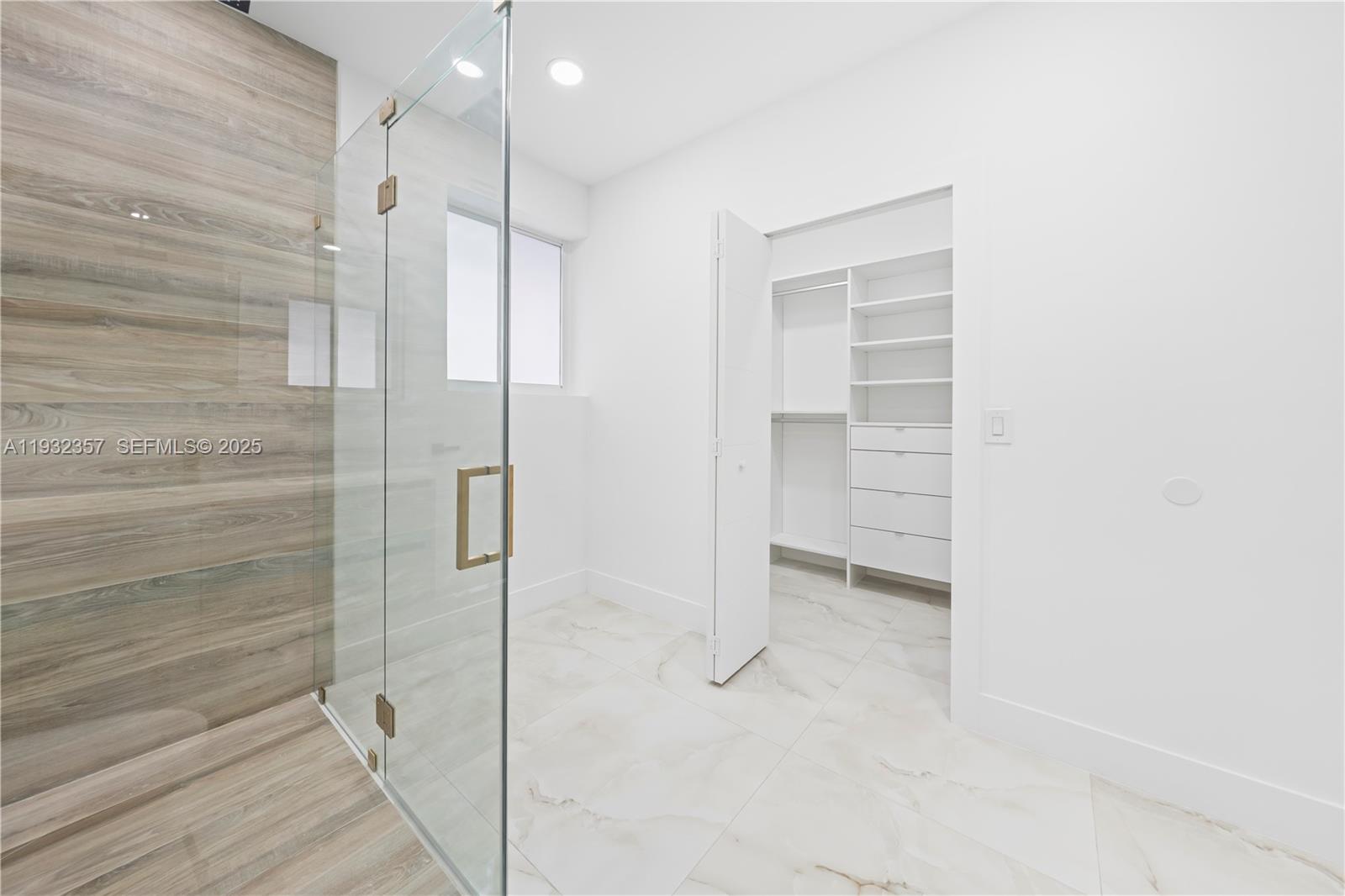 4140 Southwest 108th Avenue Miami, FL 33165 - Photo 41 of 51 a bathroom with a shower and a glass door