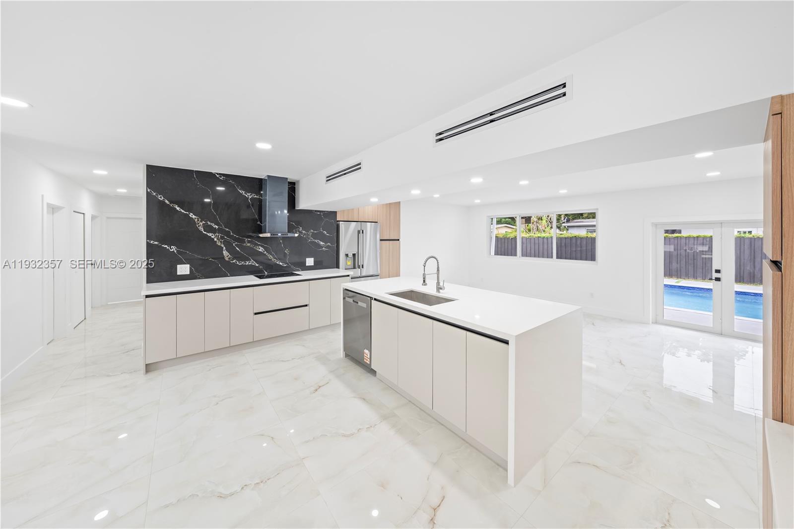 4140 Southwest 108th Avenue Miami, FL 33165 - Photo 44 of 51 a large white kitchen with cabinets and white appliances