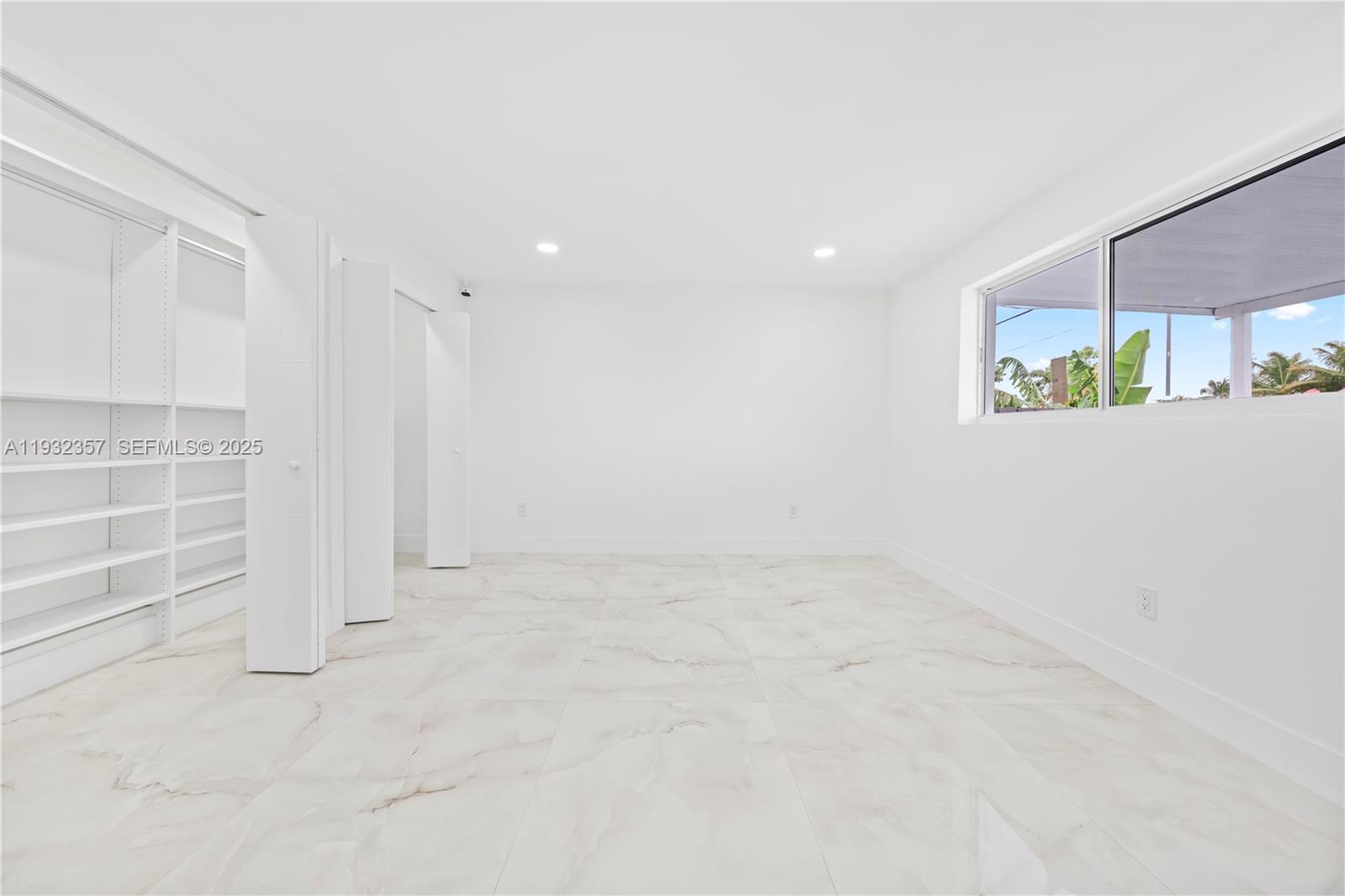 4140 Southwest 108th Avenue Miami, FL 33165 - Photo 45 of 51 an empty room with windows and entrance