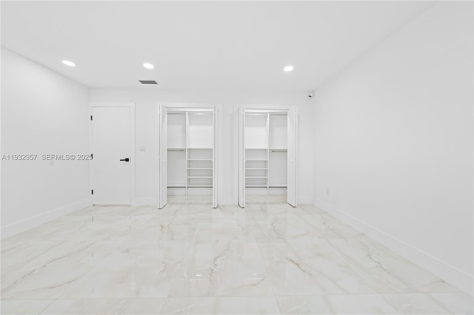 4140 Southwest 108th Avenue Miami, FL 33165 - Photo 46 of 51 an empty room with closet and windows