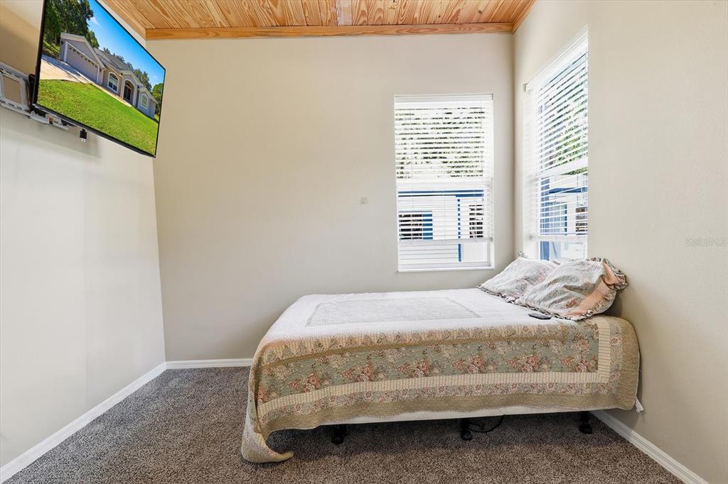 3030 South Bay Berry Point Inverness, FL 34450 - Photo 17 of 45 a bedroom with a bed and a window