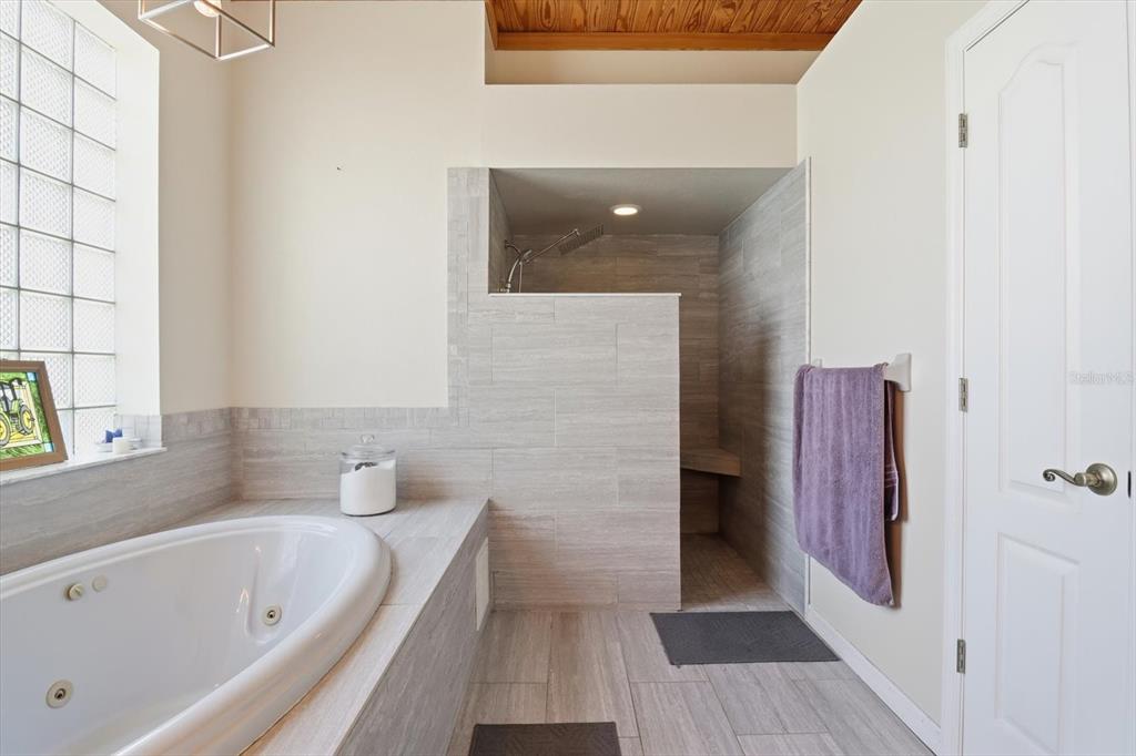 3030 South Bay Berry Point Inverness, FL 34450 - Photo 26 of 45 a bathroom with a bathtub and a shower