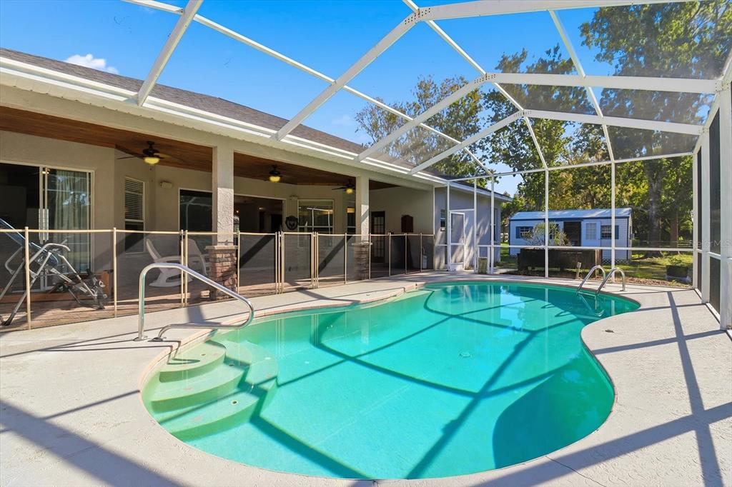 3030 South Bay Berry Point Inverness, FL 34450 - Photo 31 of 45 a view of a swimming pool with a patio