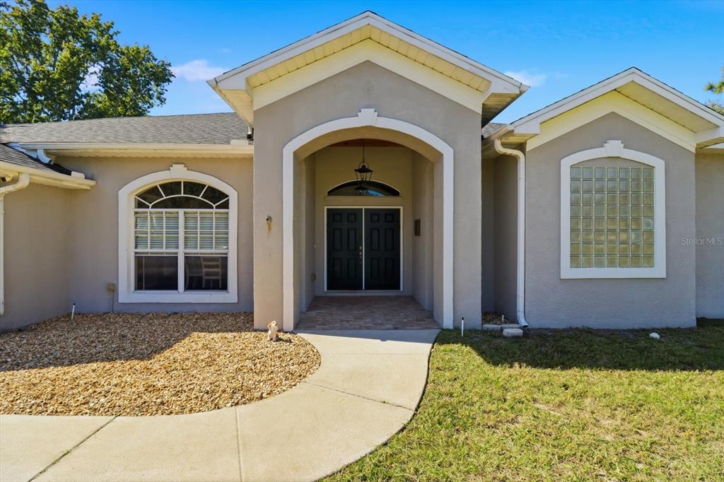 3030 South Bay Berry Point Inverness, FL 34450 - Photo 4 of 45 a front view of a house