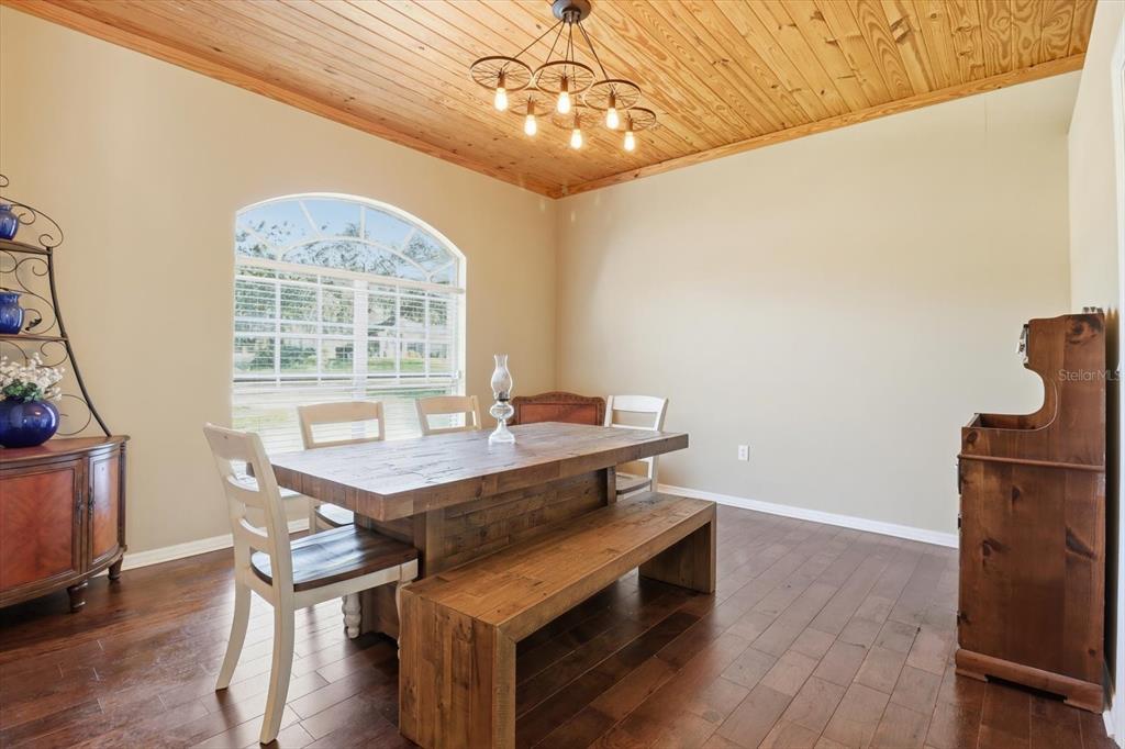 3030 South Bay Berry Point Inverness, FL 34450 - Photo 7 of 45 a view of a dining room with furniture window and wooden floor