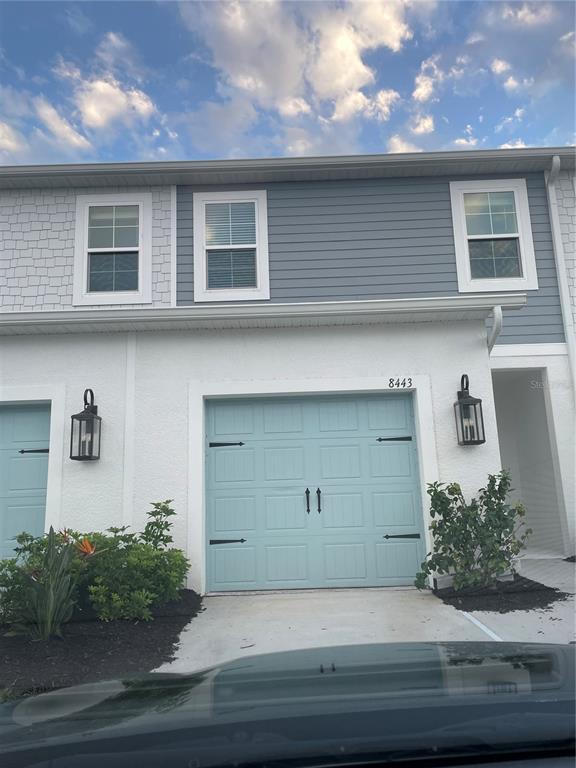 a view of a house with a garage