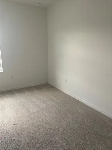 a white toilet sitting next to a shower curtain