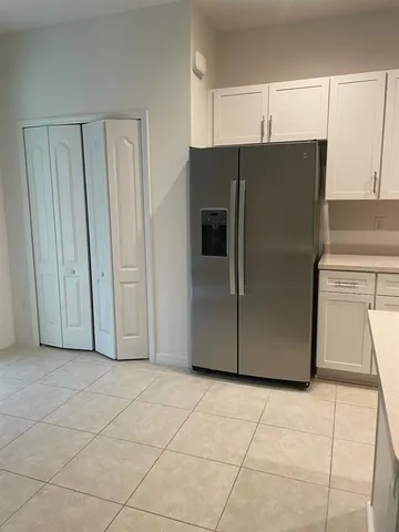 an empty room with view of bathroom