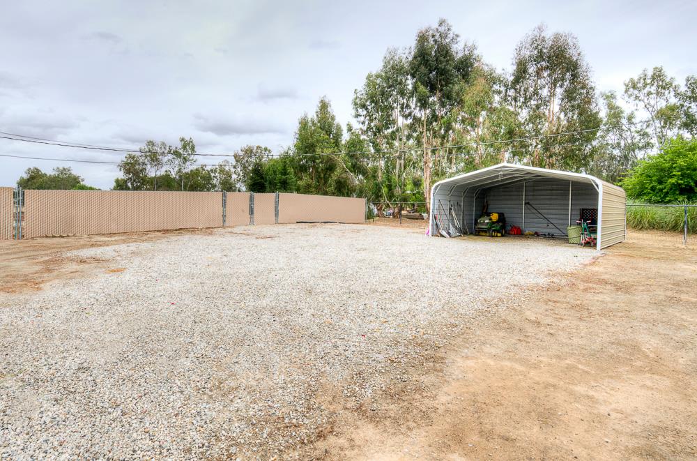 17465 Monreal Road Madera, CA 93636 - Photo 16 of 59 a view of an outdoor space and a yard