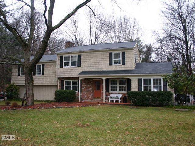 96 Stony Hill Road Ridgefield, CT 06877 - Photo 1 of 1 a front view of a house with garden
