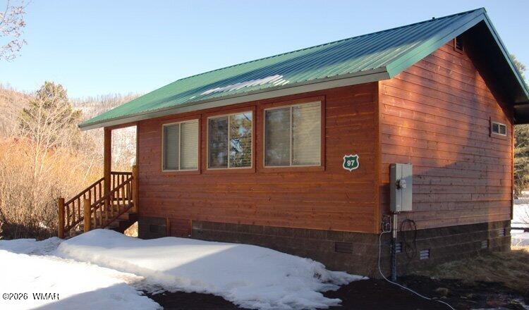 97 Rohrer Road Greer, AZ 85927 - Photo 4 of 14 a front view of a house with a yard