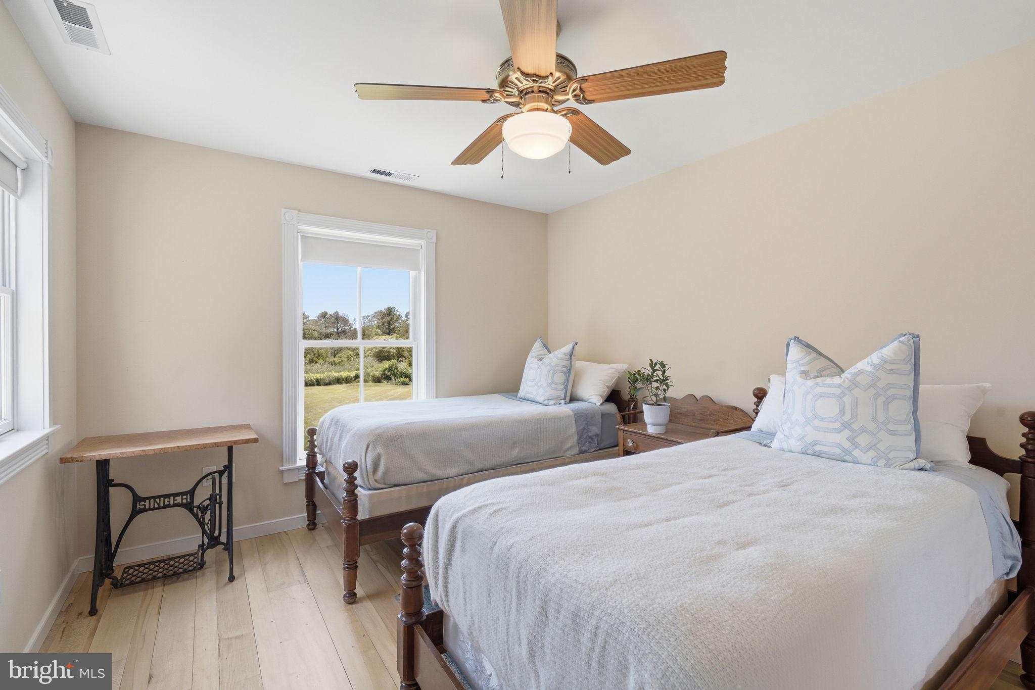 26226 Langs Landing Road Oxford, MD 21654 - Photo 28 of 48 a bedroom with two beds and a window