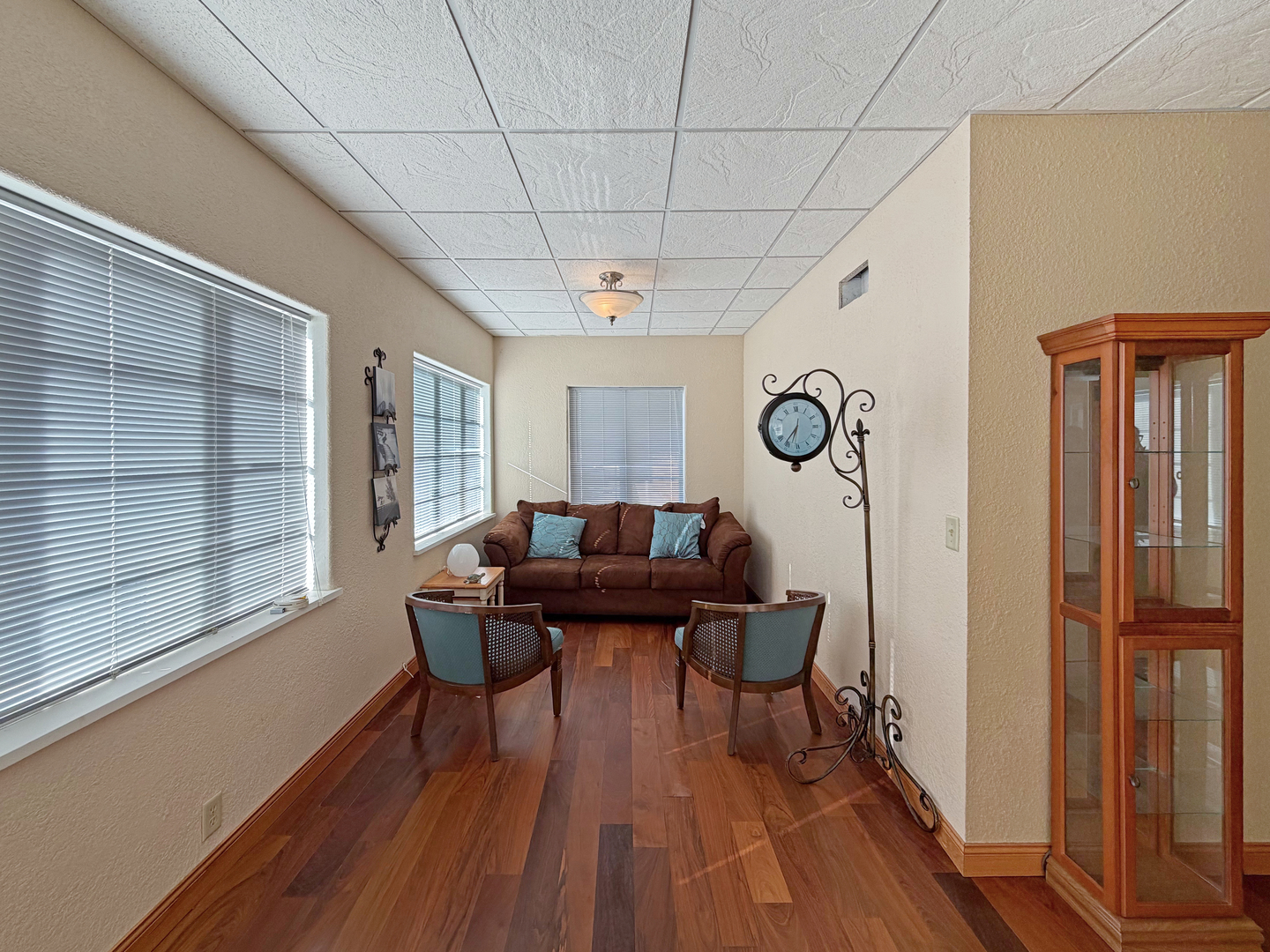 222 West Exchange Street Freeport, IL 61032 - Photo 12 of 46 a living room with furniture a window and wooden floor