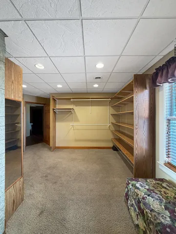 a room with furniture pool and chair