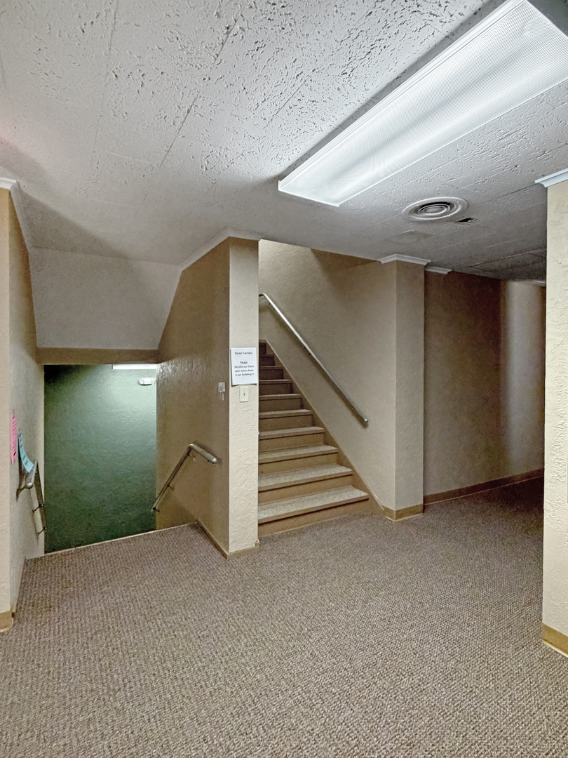 222 West Exchange Street Freeport, IL 61032 - Photo 26 of 46 a view of an empty room with stairs