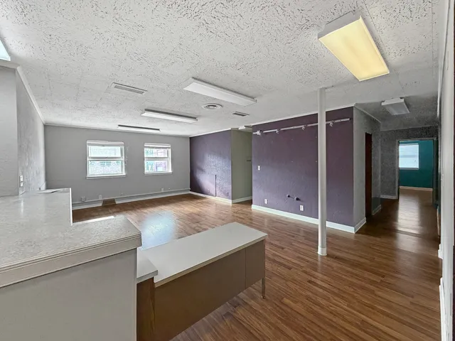 wooden floor and dining room with furniture