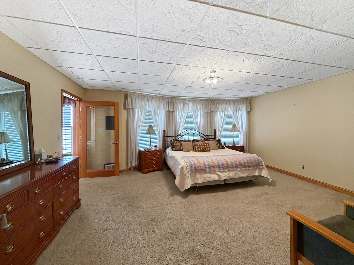 222 West Exchange Street Freeport, IL 61032 - Photo 37 of 46 a spacious bedroom with a bed and a dresser in it