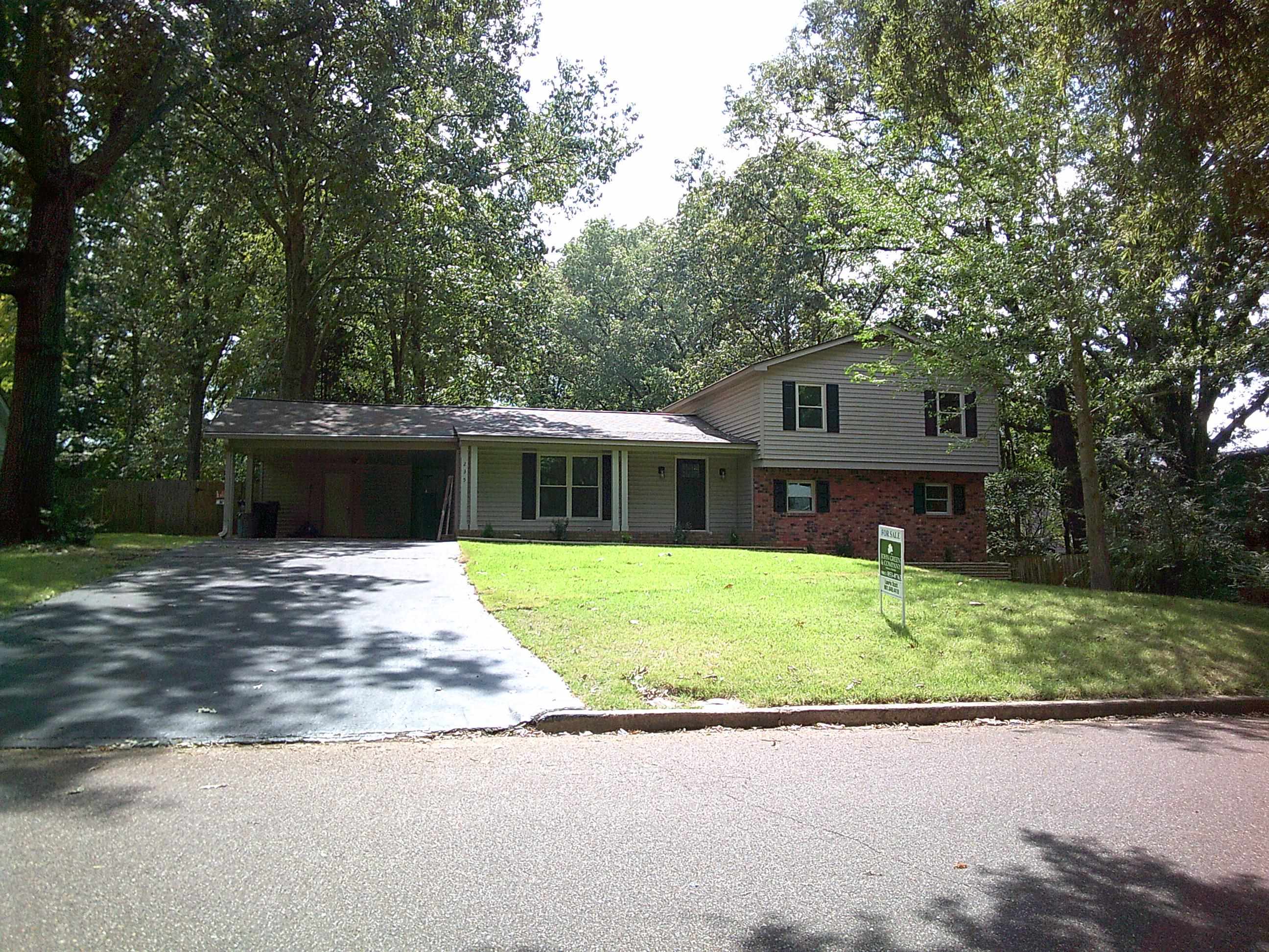 235 Morton Road Collierville, TN 38017 - Photo 1 of 18 a front view of a house with a garden and yard