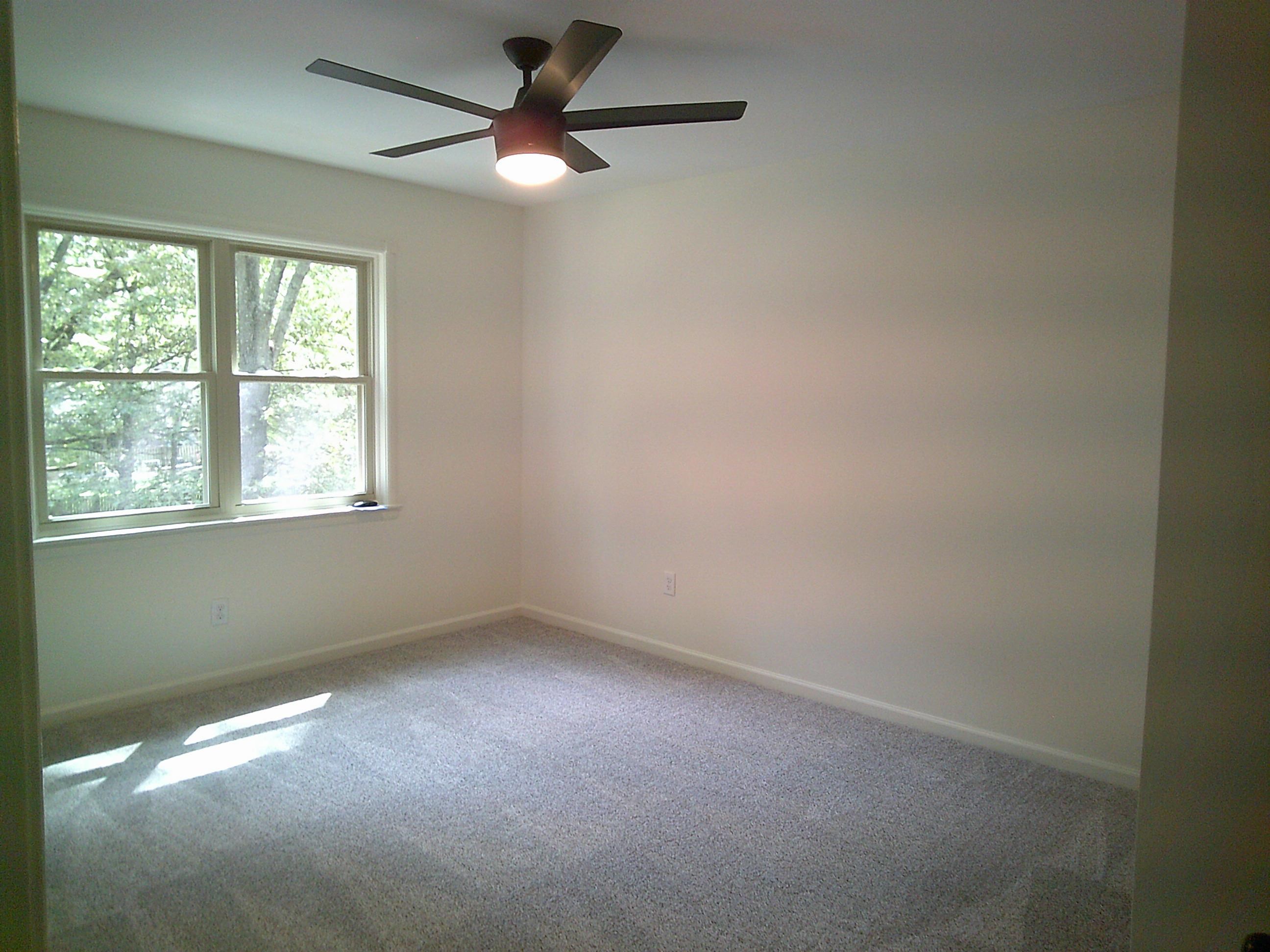 235 Morton Road Collierville, TN 38017 - Photo 11 of 18 an empty room with a window and a fan