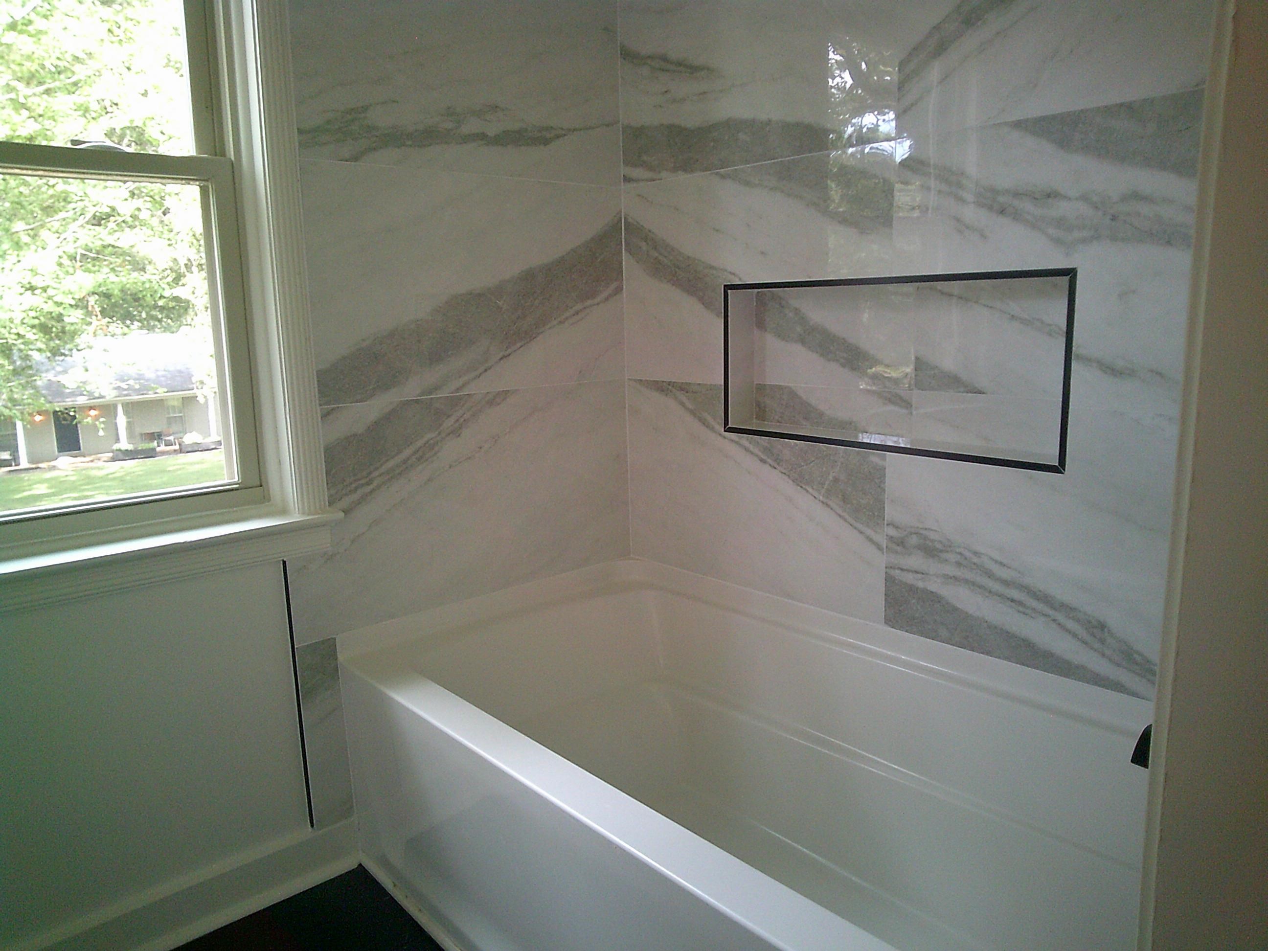 235 Morton Road Collierville, TN 38017 - Photo 12 of 18 a bathroom with a bathtub and a shower
