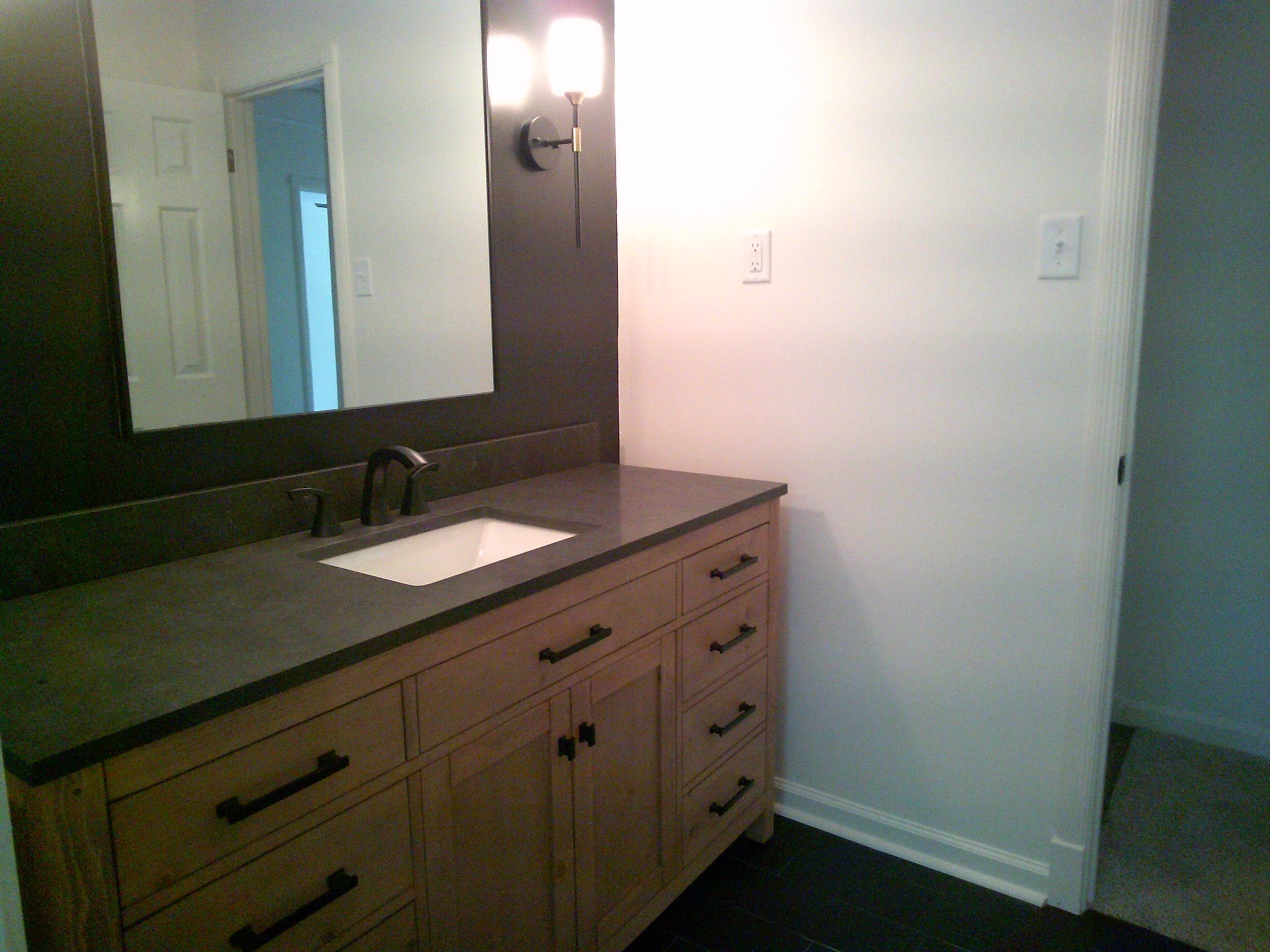 235 Morton Road Collierville, TN 38017 - Photo 13 of 18 a bathroom with a sink and a mirror