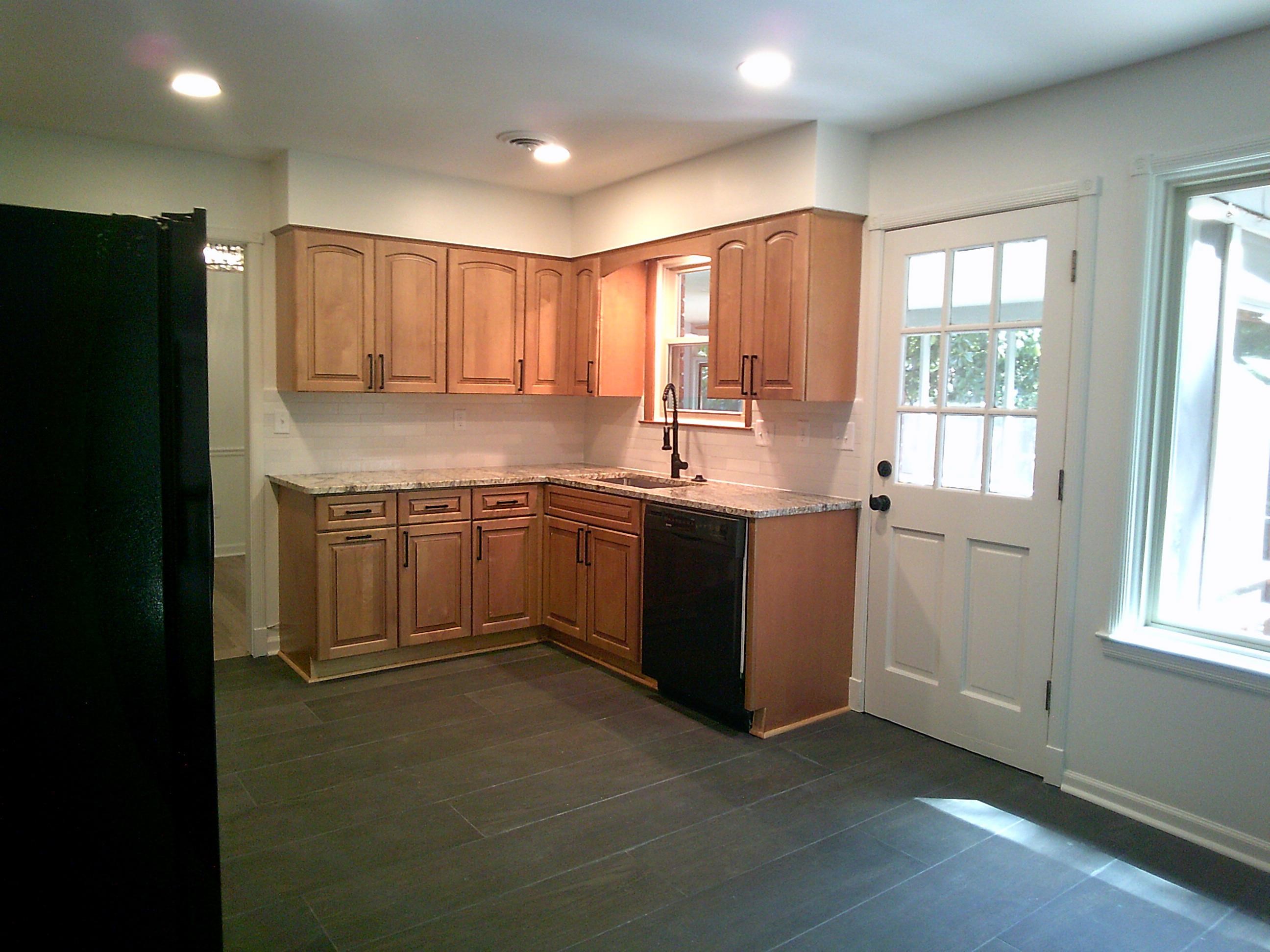 235 Morton Road Collierville, TN 38017 - Photo 4 of 18 a kitchen with a sink window and cabinets