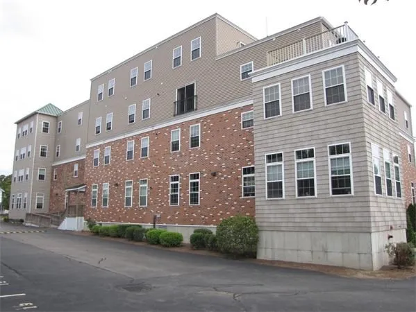 a front view of a building with a road