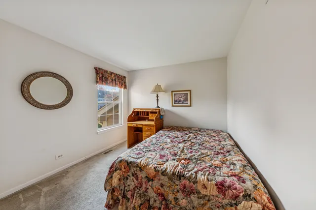 a bedroom with a bed and a cabinets