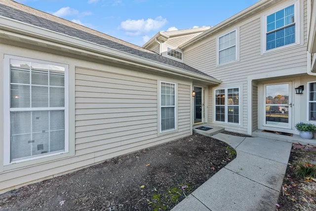 a front view of a house with a large window
