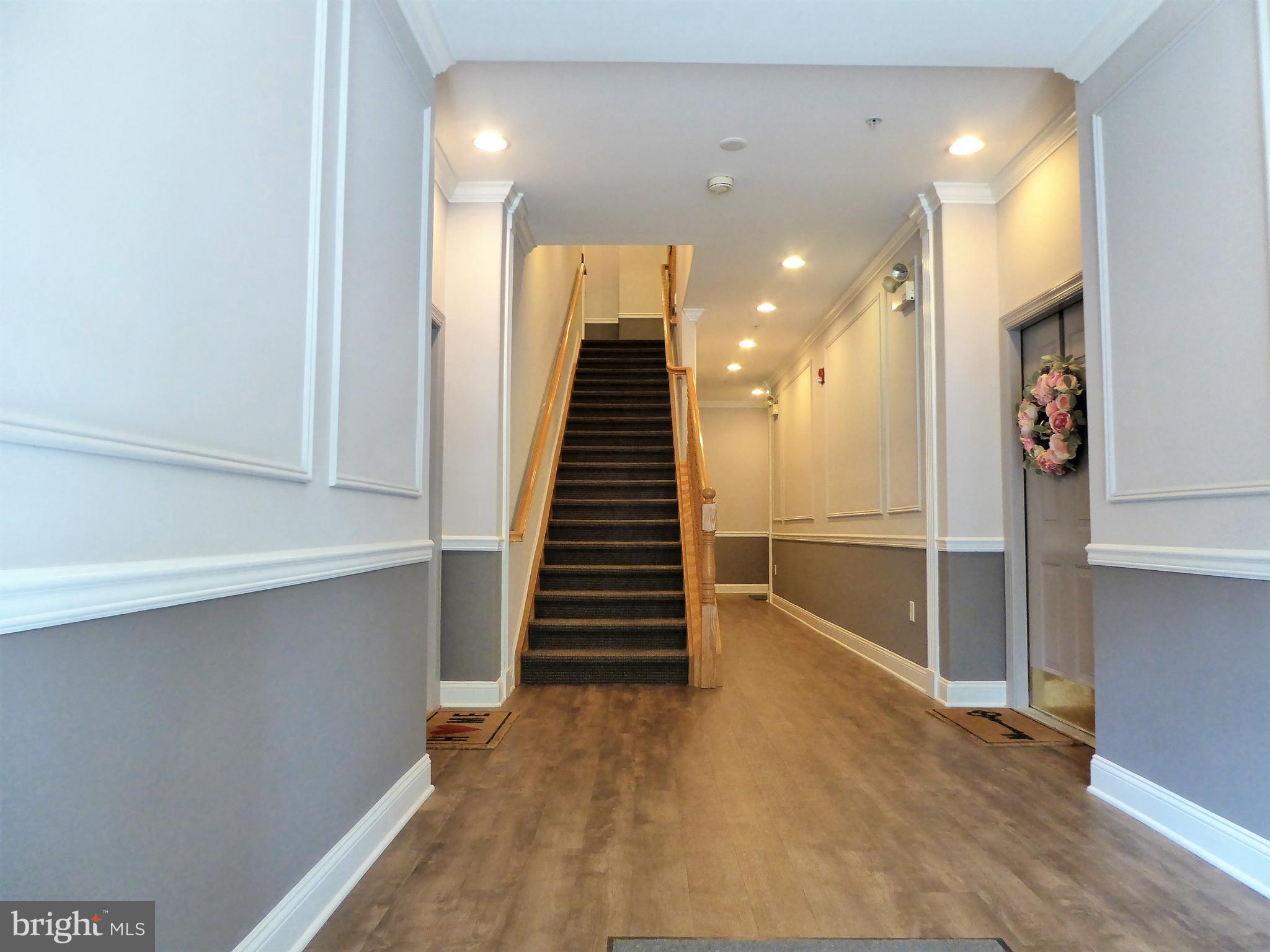 21 Kyle Way Ewing, NJ 08628 - Photo 2 of 22 Secured entry to large hallway entrance.