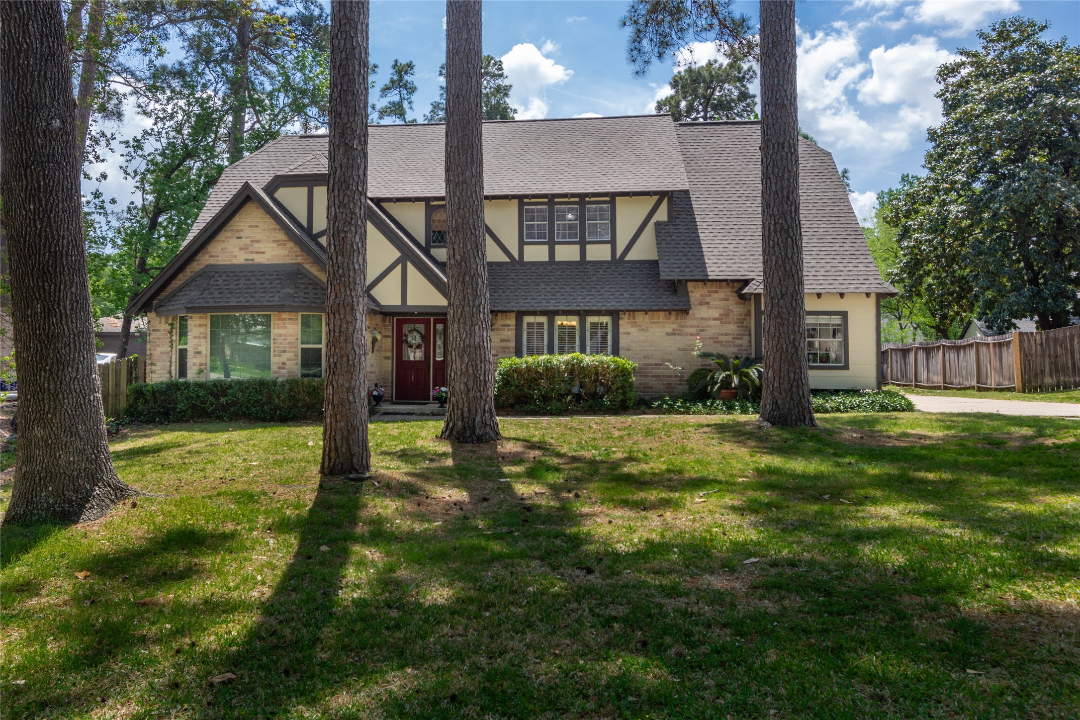 6411 Northway Drive Spring, TX 77389 - Photo 38 of 39 a view of a house with a yard and a large tree