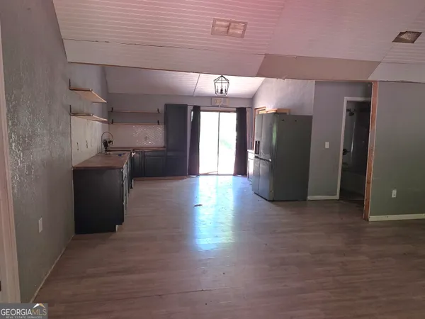 a view of a refrigerator in kitchen and dining room