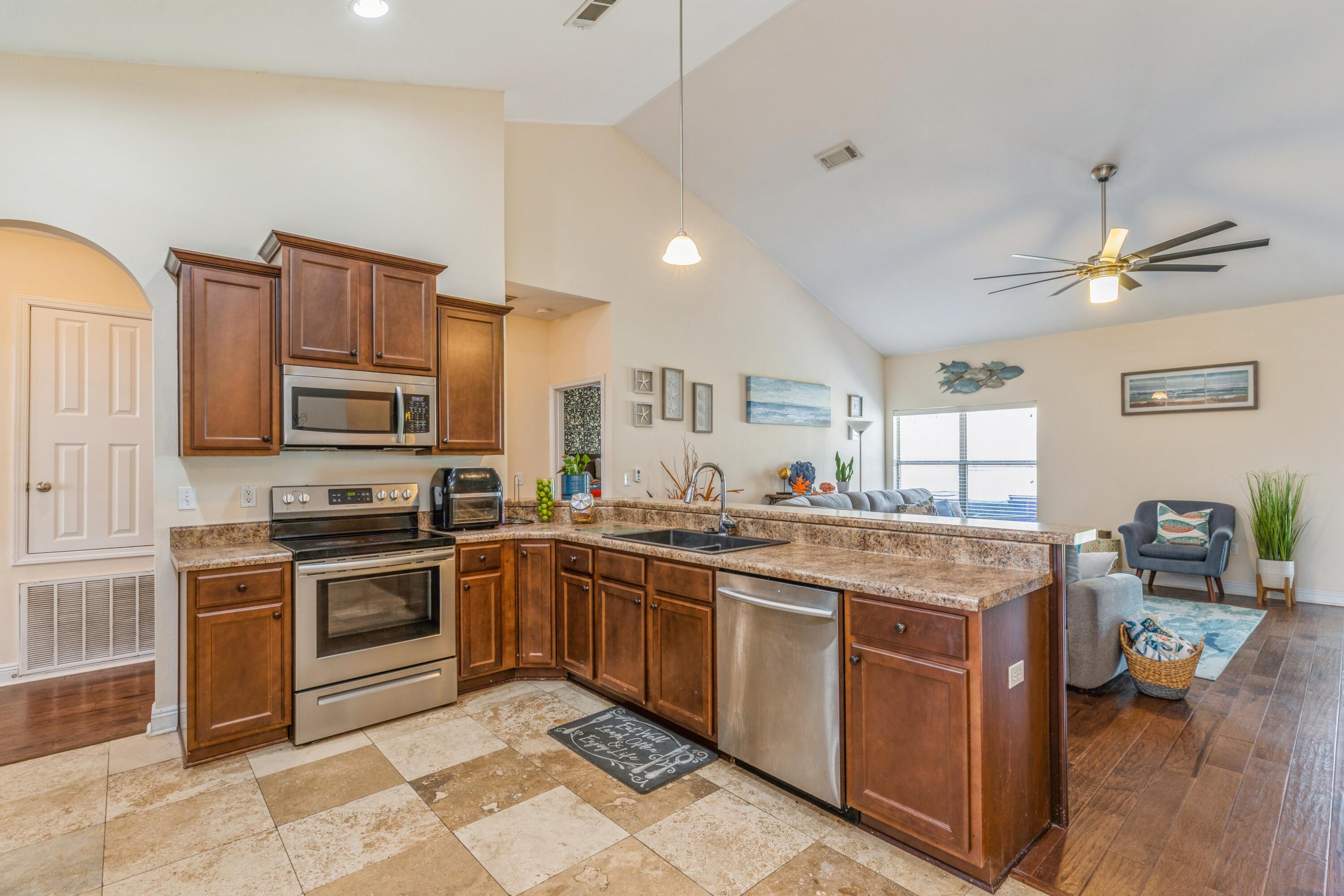 609 Rowan Circle Crestview, FL 32536 - Photo 18 of 37 a kitchen with a sink stove and microwave