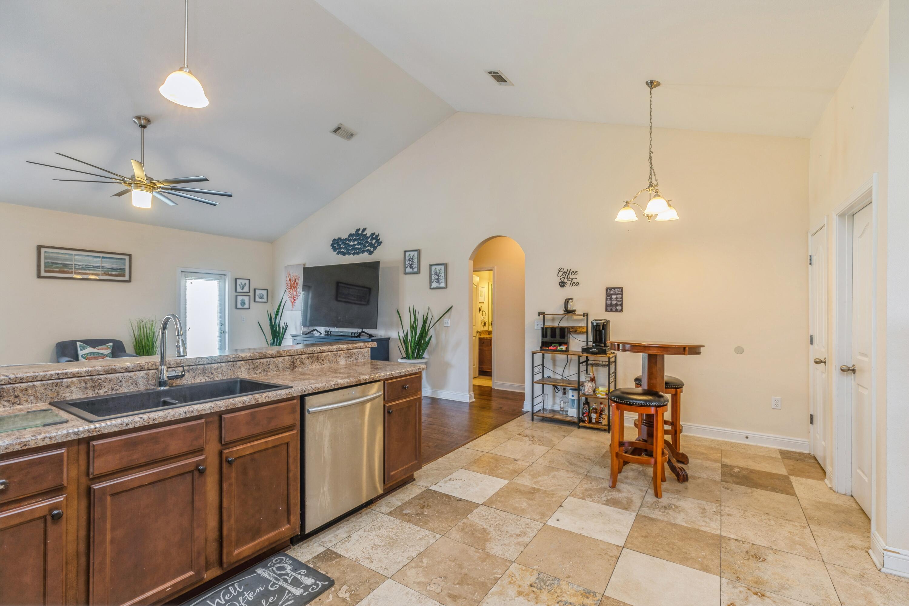 609 Rowan Circle Crestview, FL 32536 - Photo 19 of 37 a very nice looking dining room with a large center island and some appliances