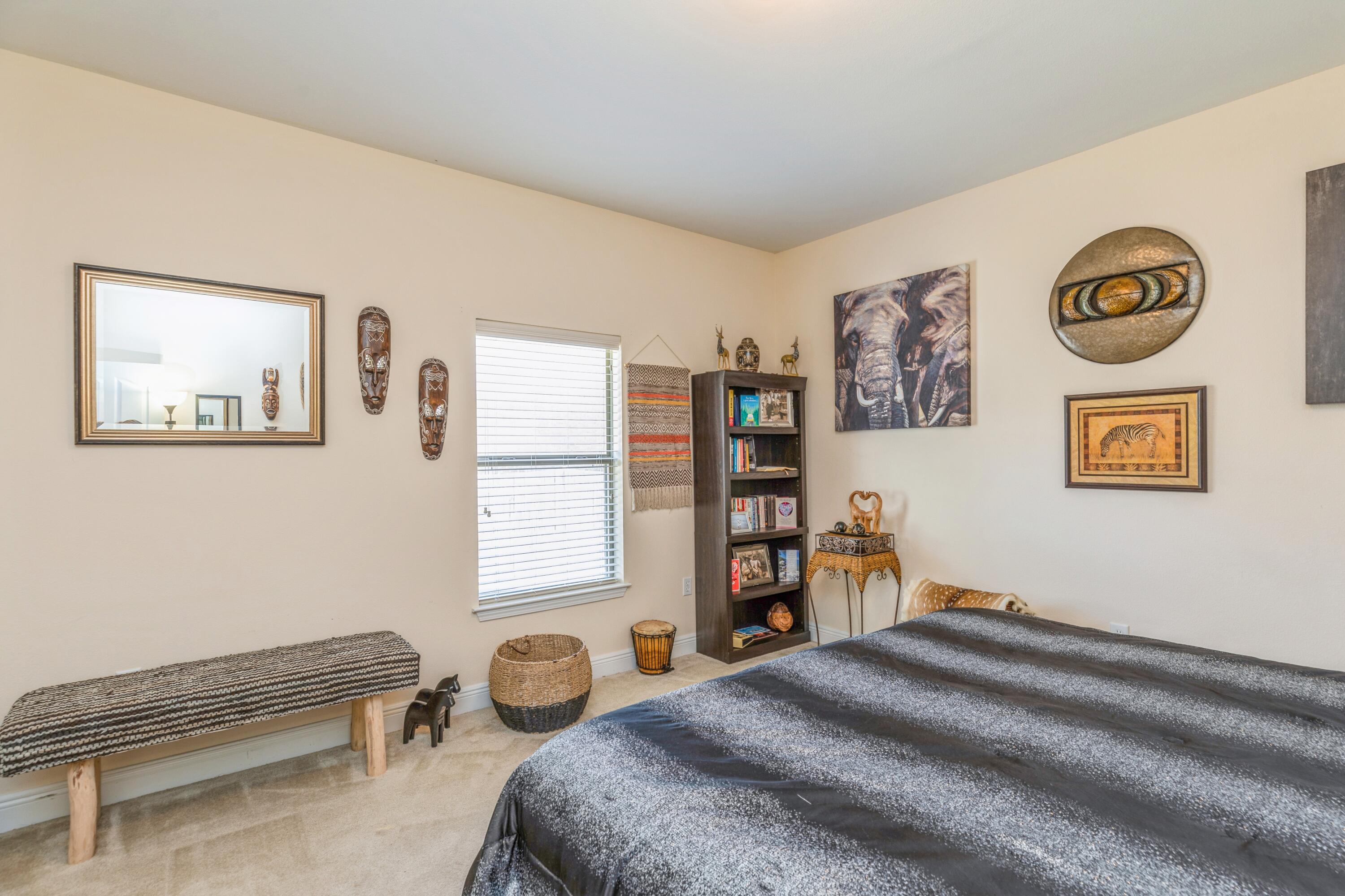609 Rowan Circle Crestview, FL 32536 - Photo 20 of 37 a bedroom with a bed and a bookshelf