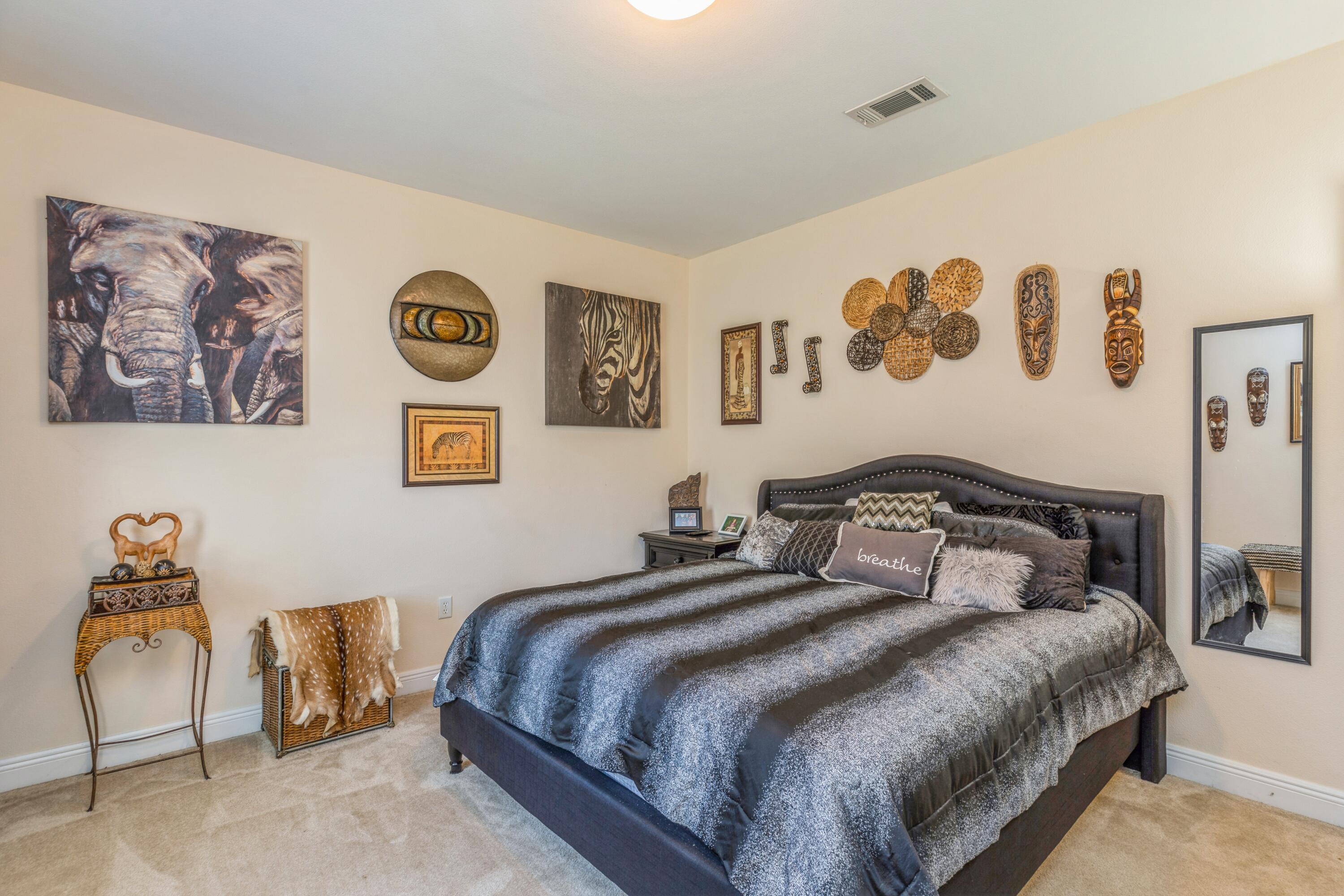 609 Rowan Circle Crestview, FL 32536 - Photo 21 of 37 a bedroom with a bed and wall painting