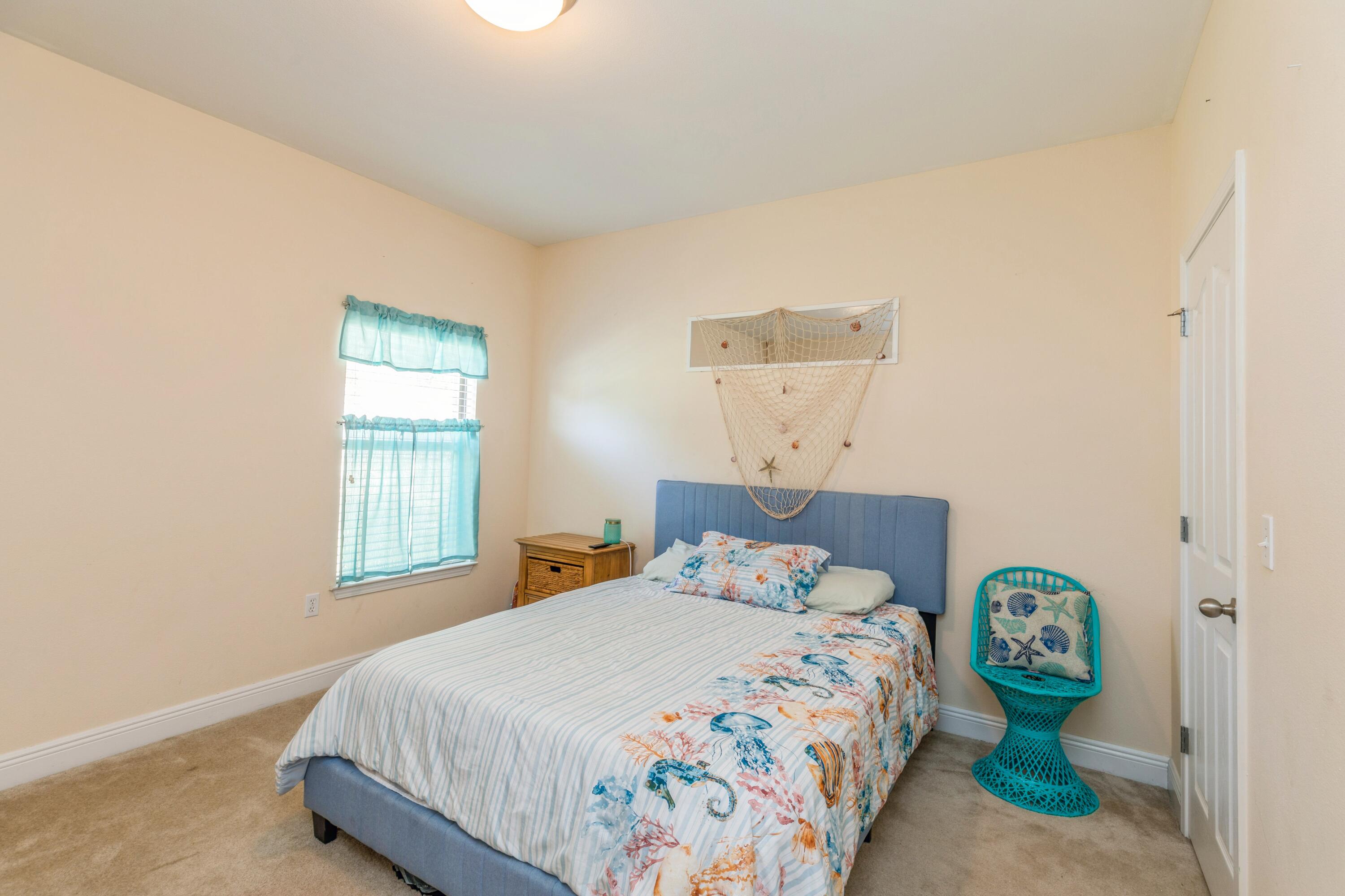 609 Rowan Circle Crestview, FL 32536 - Photo 23 of 37 a bedroom with bed and window